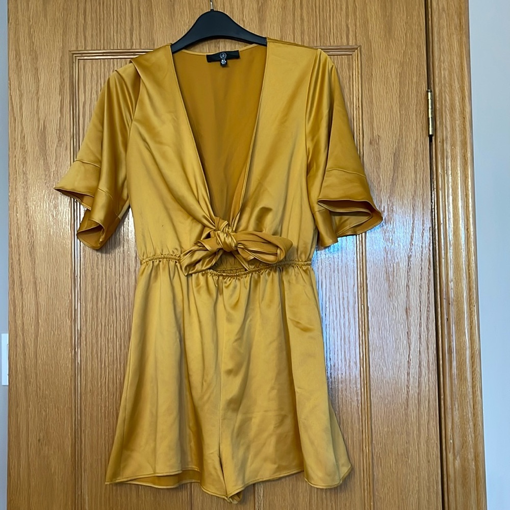 mustard yellow front tie romper. Size 2
